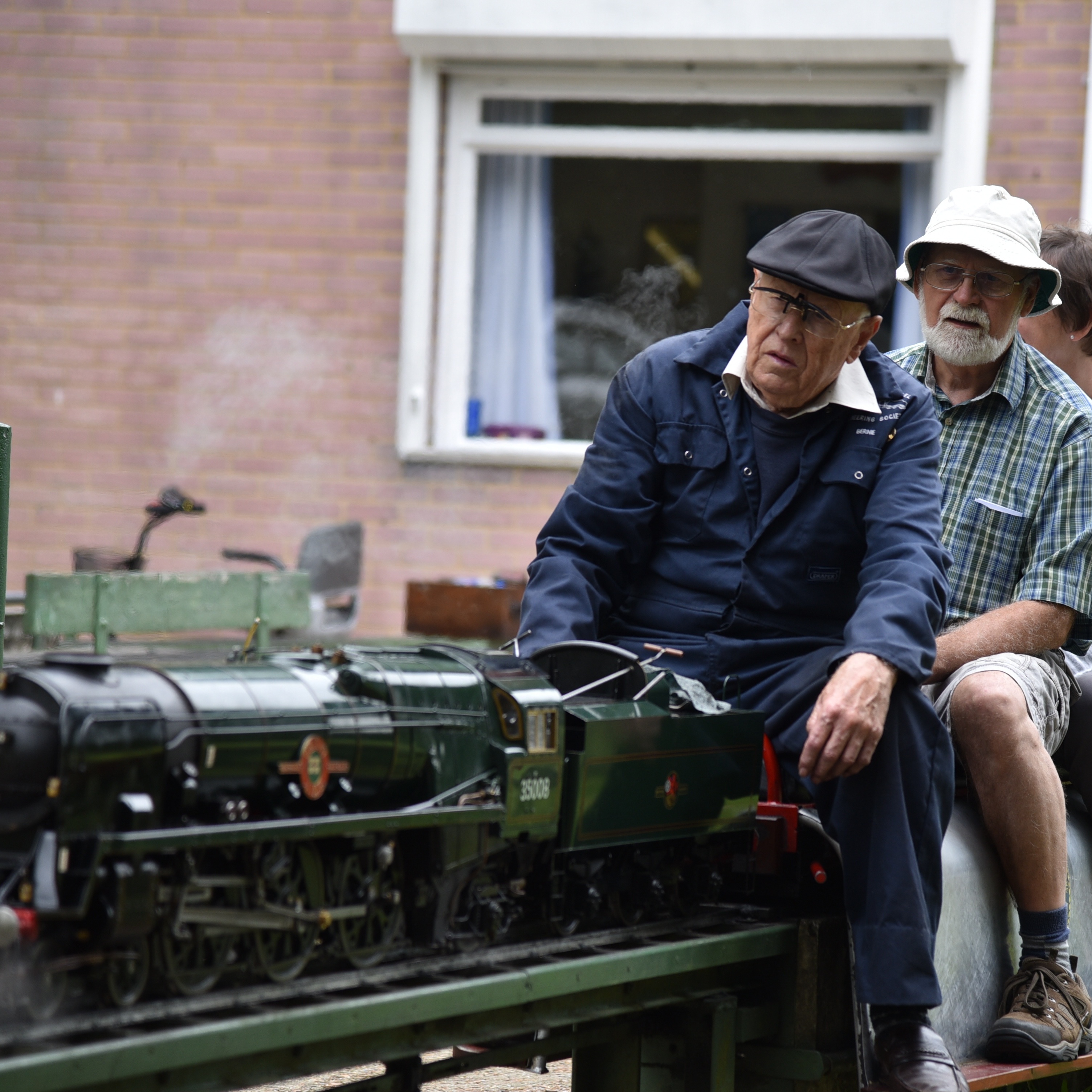 Circular picture of two old blokes on a steam engine. Click here to learn more about our railway.